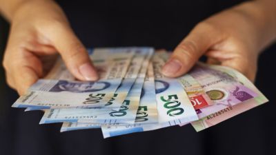 high angle hands holding mexican banknotes